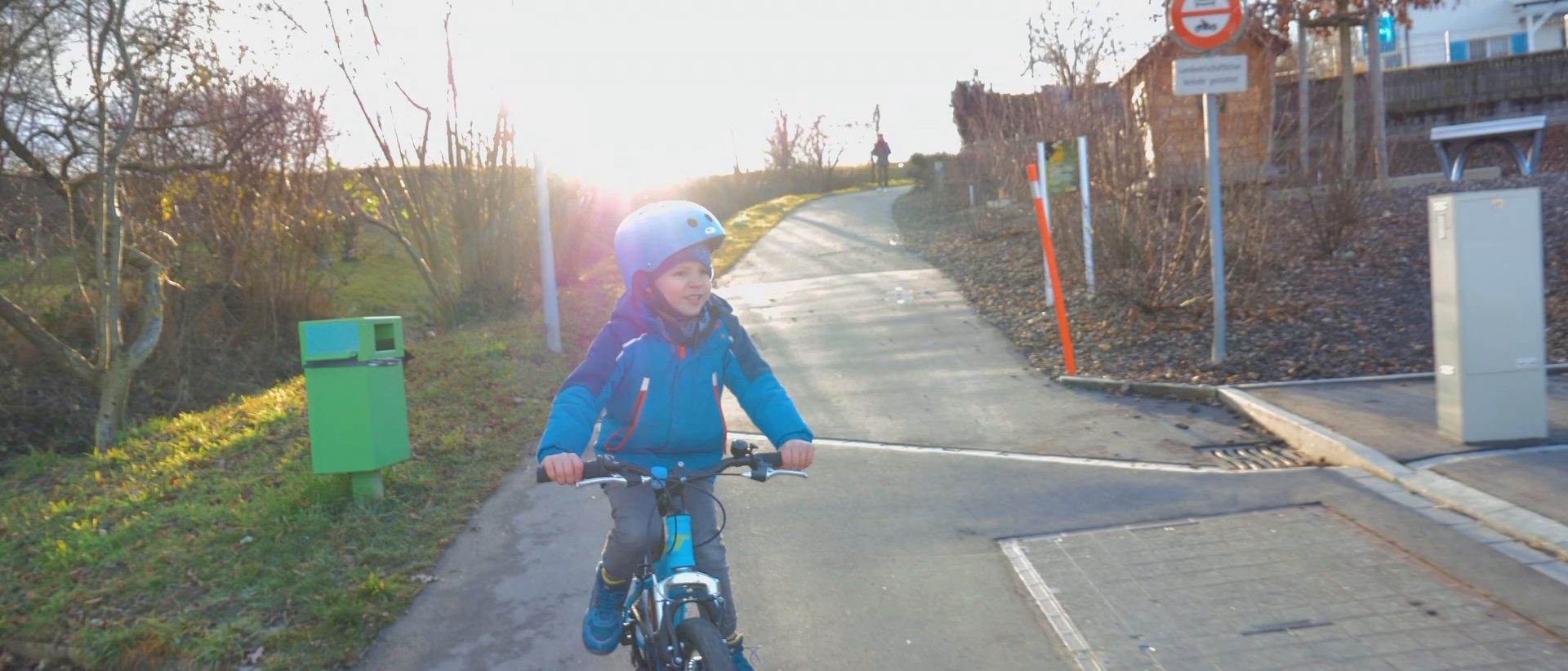 Young rider on a sunlit bike path